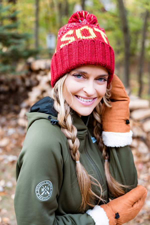 Woman wearing a sota beanie. This beanie is inspired by the Minnesota Gophers.
