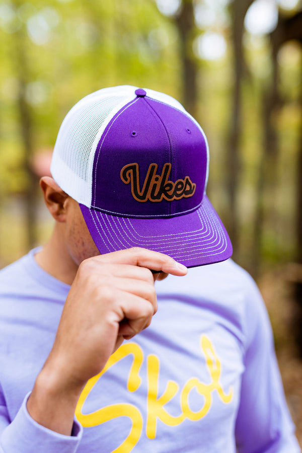 Man wearing a Minnesota Vikings inspired hat.