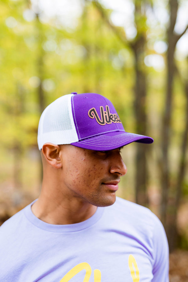 Man wearing a Minnesota Vikings inspired hat.
