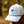 Grey Dri-fit baseball cap with a blue Minnesota logo worn by a person in a forest setting