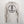 Beige sota clothing hoodie with black logo on a white brick wall background